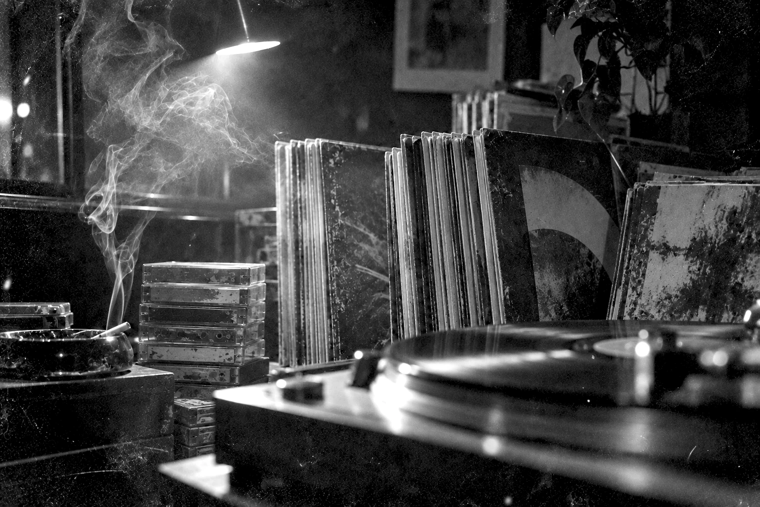 Records and cassettes in a smoky room at night